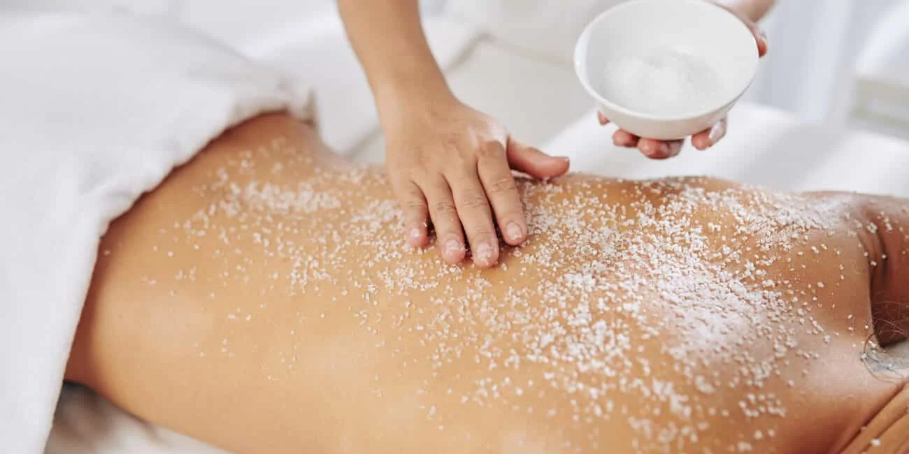 Body scrub being gently applied during a spa treatment